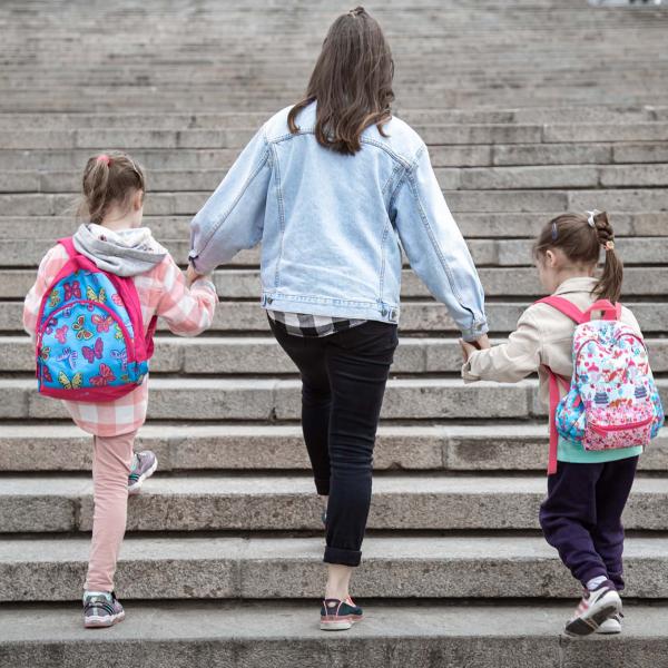 Mother walking with children